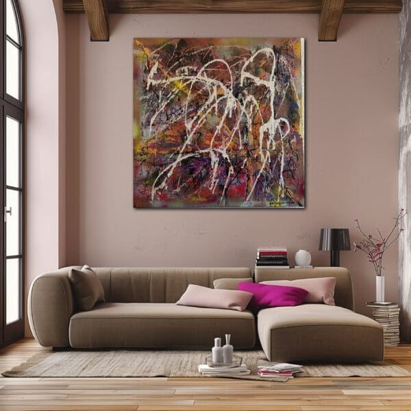 A living room with a couch and a painting on the wall