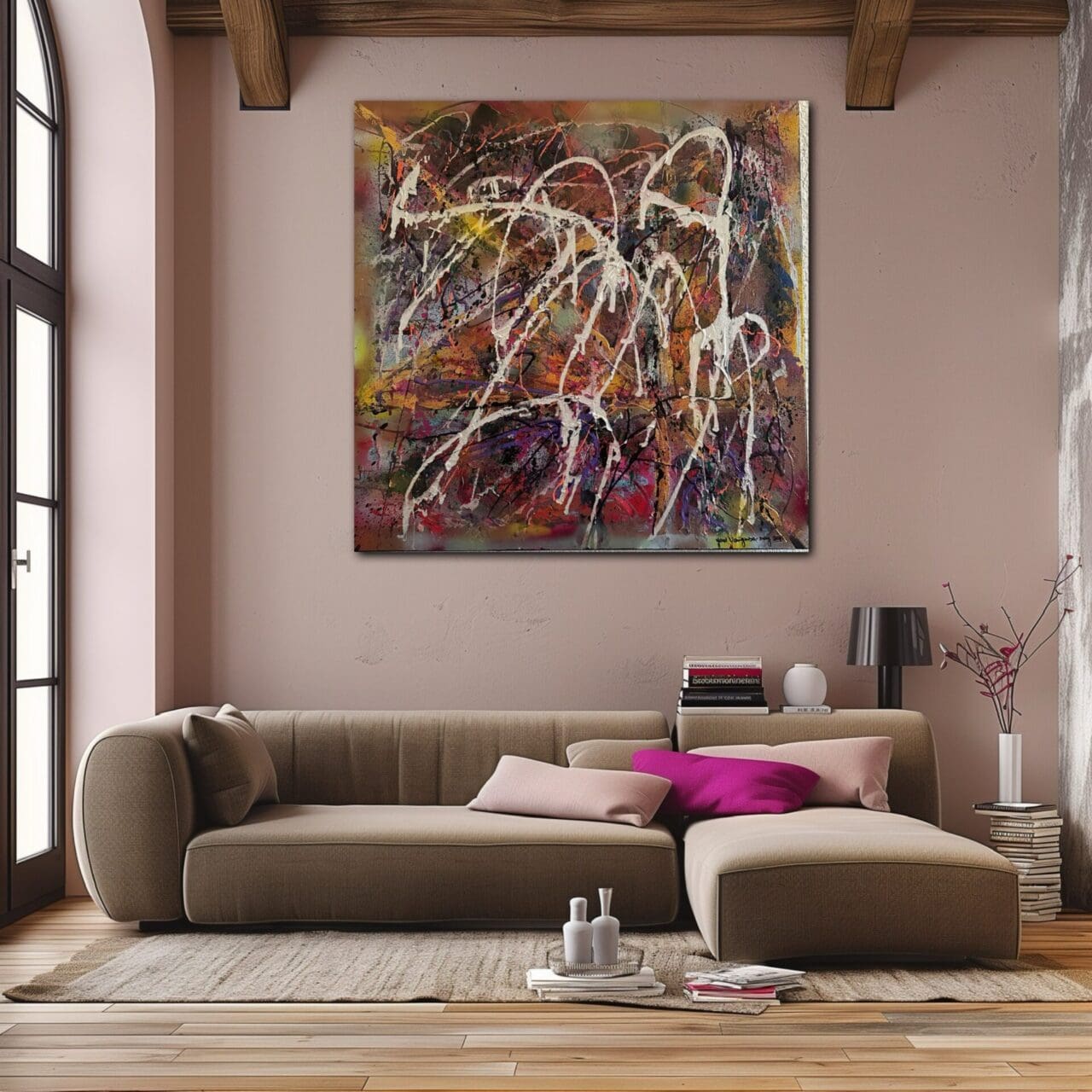 A living room with a couch and a painting on the wall