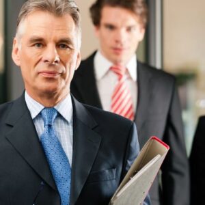 Business team leader holding folder.