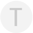 Here's a short alt tag for the image: `Grey circle with letter T`